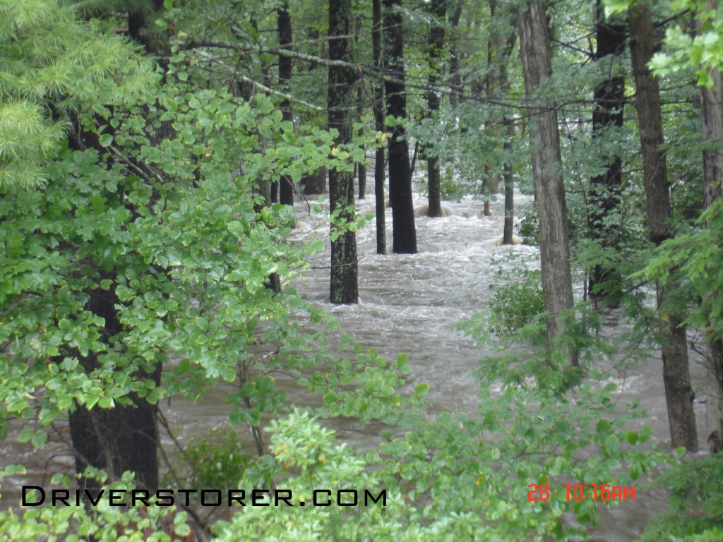 Flood waters rush through the forest where flood waters have never been in Saw Creek Estates, Bushkill PA
