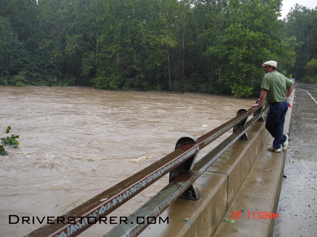A man watches the Broadheadsville Creek flow only a few feet under his feet near the Delaware River in the Delaware Water Gap