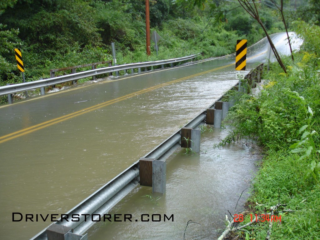 Water overtakes a bridge on Hollow Road near Shawnee Mountain